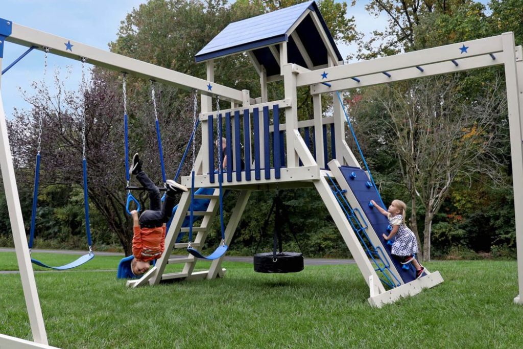 Climbing playset model with swings, slides, rockwall, cargo net and tire swing